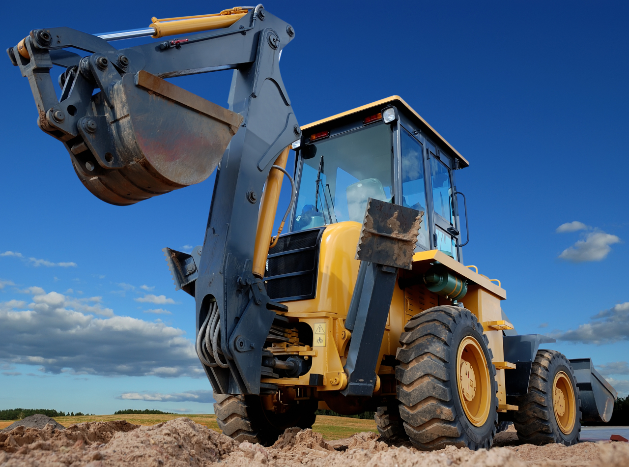 żółta koparko-ładowarka