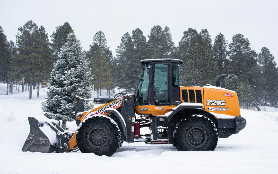 Ładowarka teleskopowa na śniegu